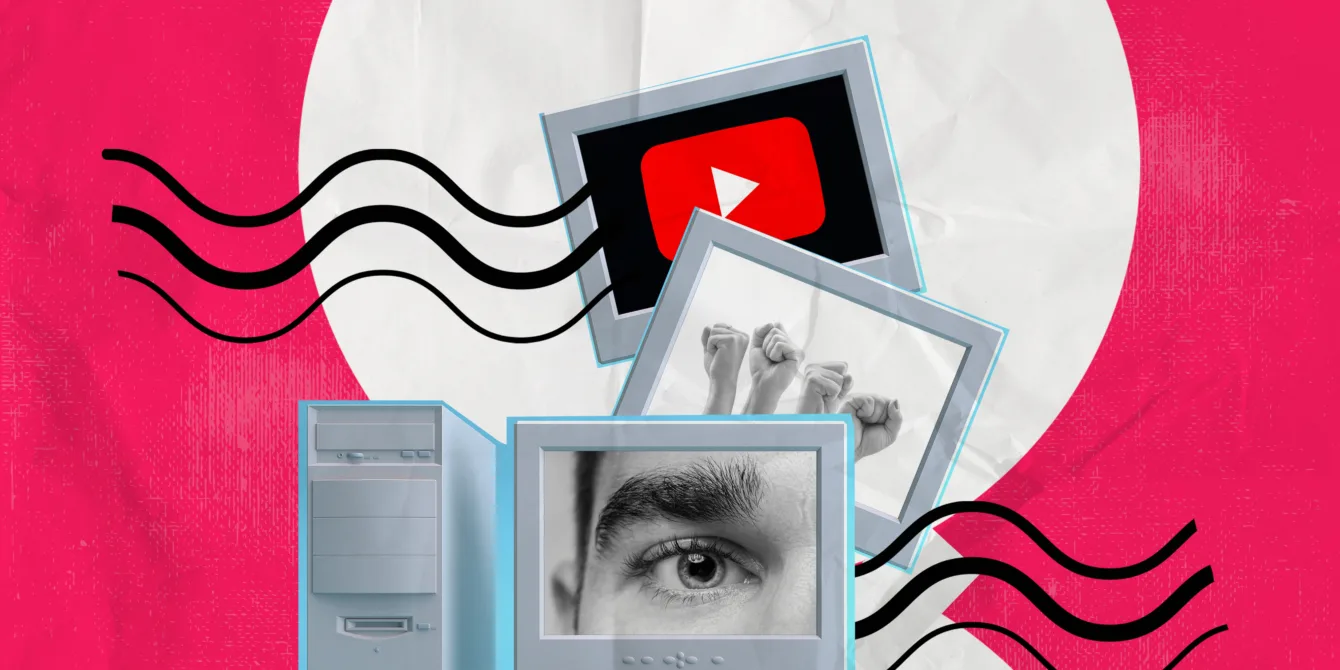 computer displaying and image of an eye, hand, youtube logo
