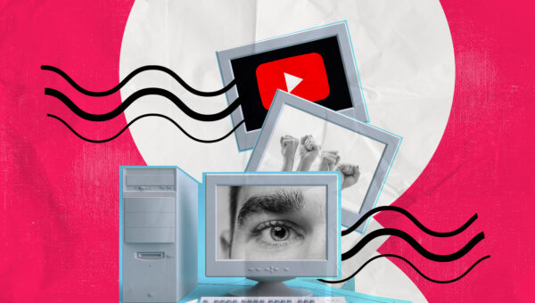 computer displaying and image of an eye, hand, youtube logo