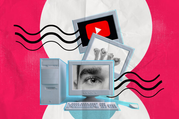computer displaying and image of an eye, hand, youtube logo