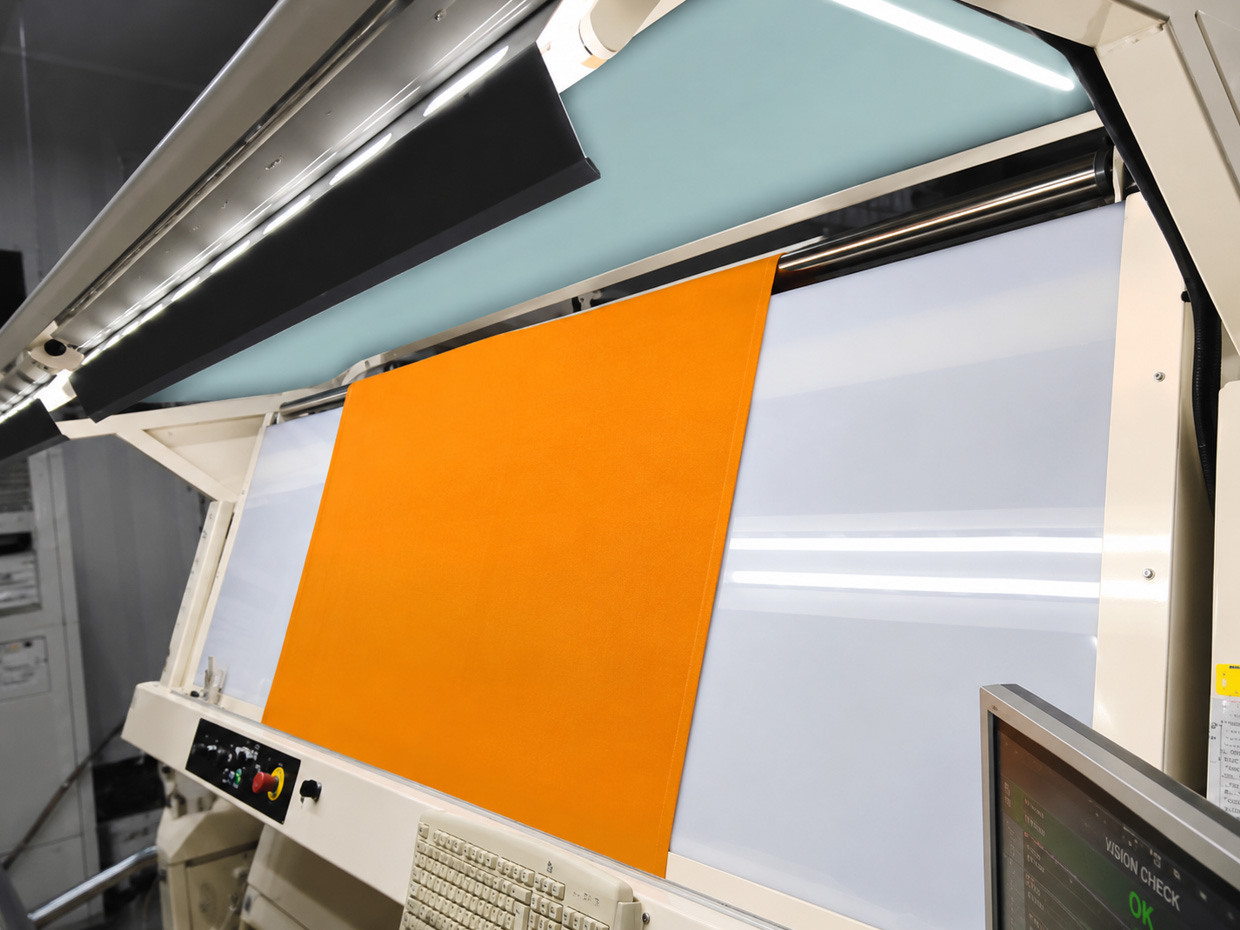 Current fabric visual inspection line at a Baltic sportswear manufacturing facility